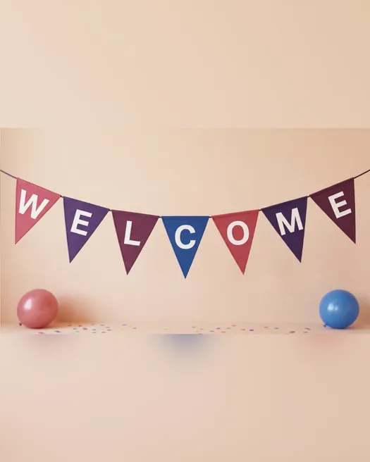 The whole WELCOME banner and both balloons, with a blurred copy of the photo above and below.